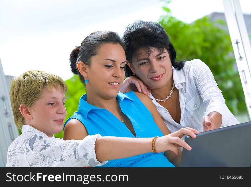 Portrait of happy family getting busy with laptop. Portrait of happy family getting busy with laptop