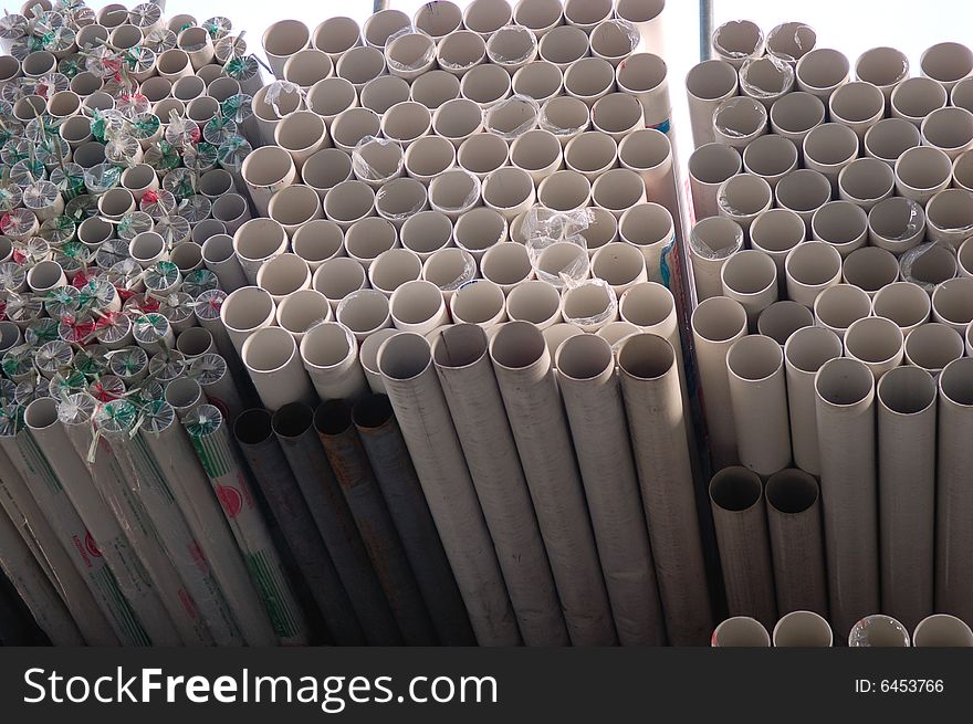 Drainage pipes stacked at a construction site