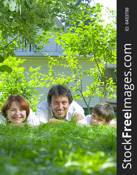 Portrait of young happy family in summer environment. Portrait of young happy family in summer environment