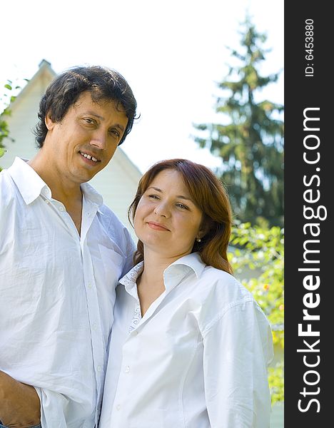 Portrait of young happy couple in summer environment. Portrait of young happy couple in summer environment