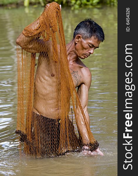 Fisherman Of Thailand With Throw Net