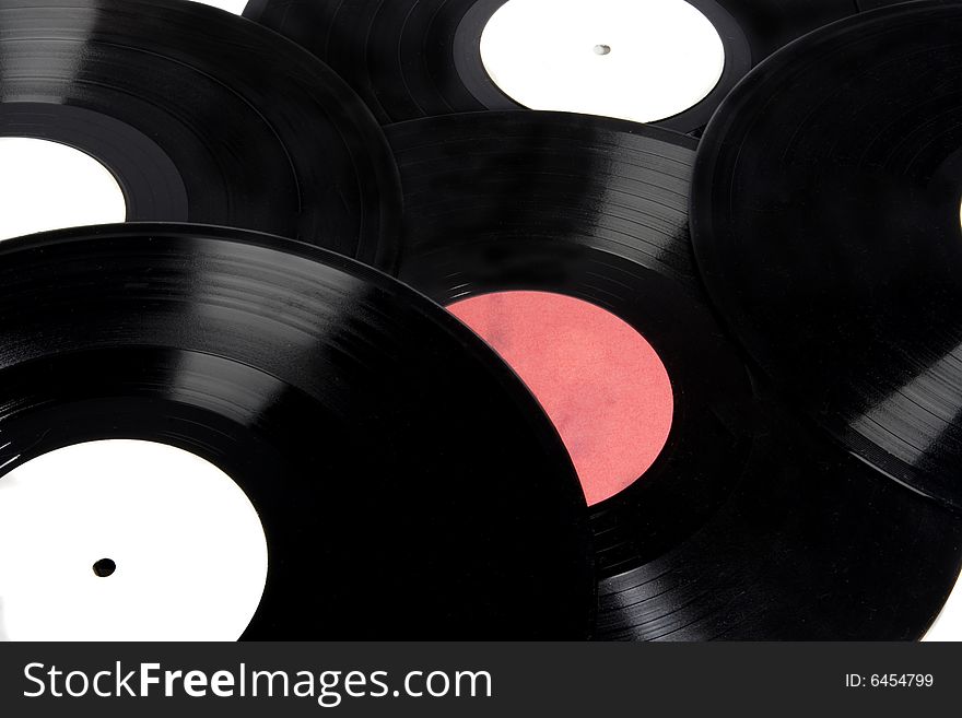 Background of vinyl records with red and white labels