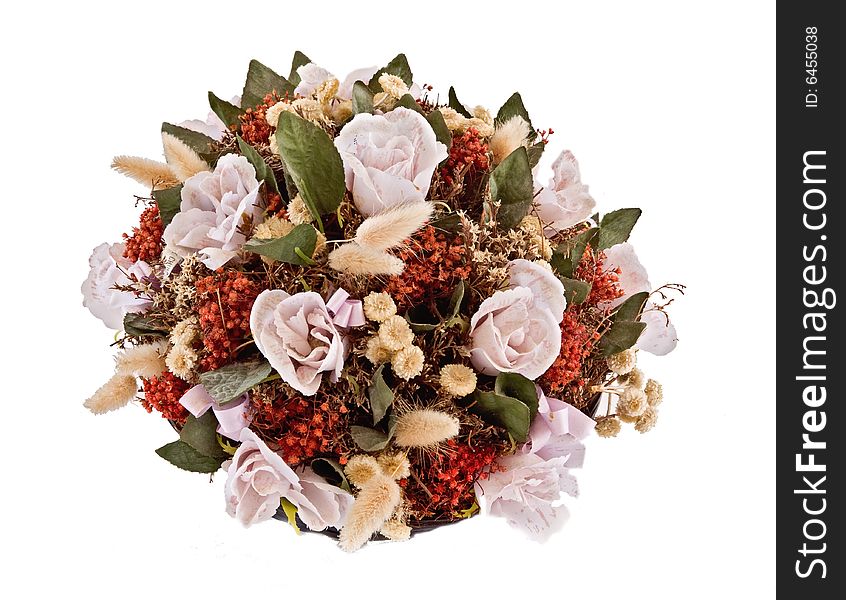 Decorative traditional wick basket with fake flowers in it. Decorative traditional wick basket with fake flowers in it