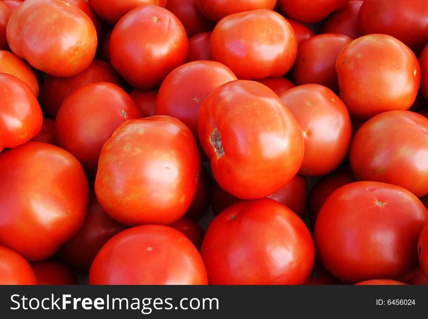 Red tomatoes seen up close at the farmers market