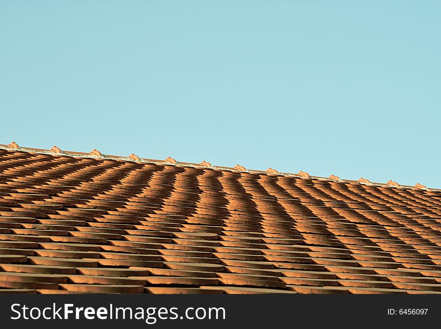 Detail of a roofing tile with a piece of sky