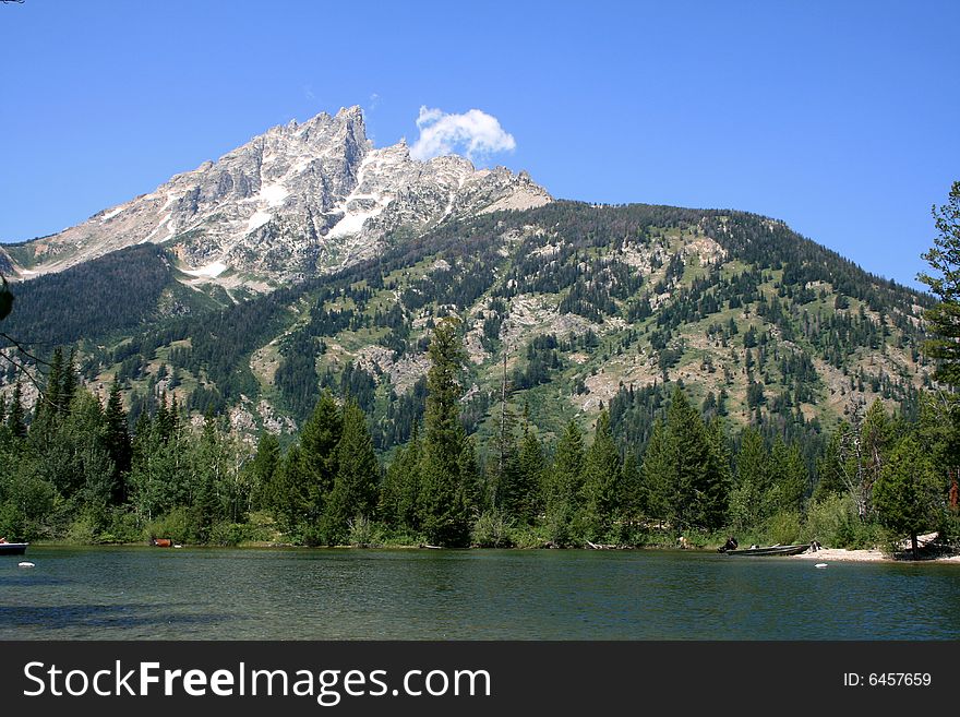 The lake and alps of Rocky Mountains, covered by snow