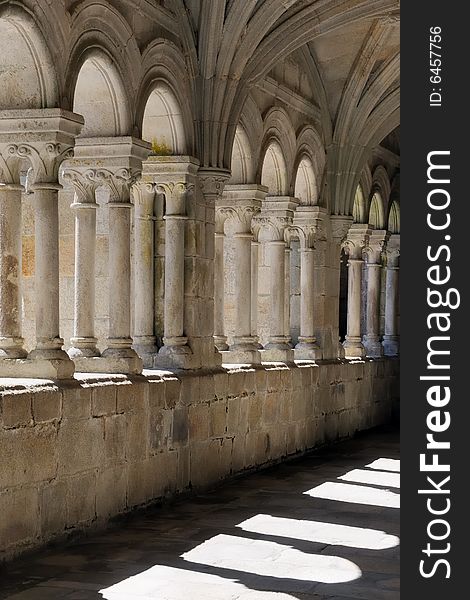 Cloister of an old abbey in light and shadows. Cloister of an old abbey in light and shadows