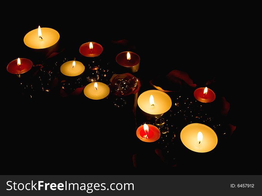 The lighted decorative candles in the dark