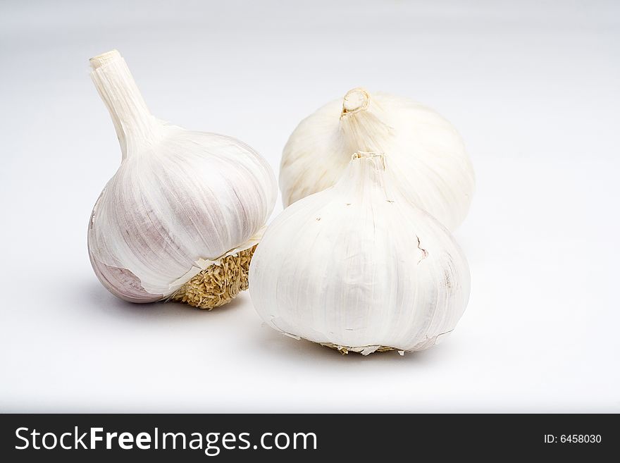 Natural raw garlic isolated on a white background