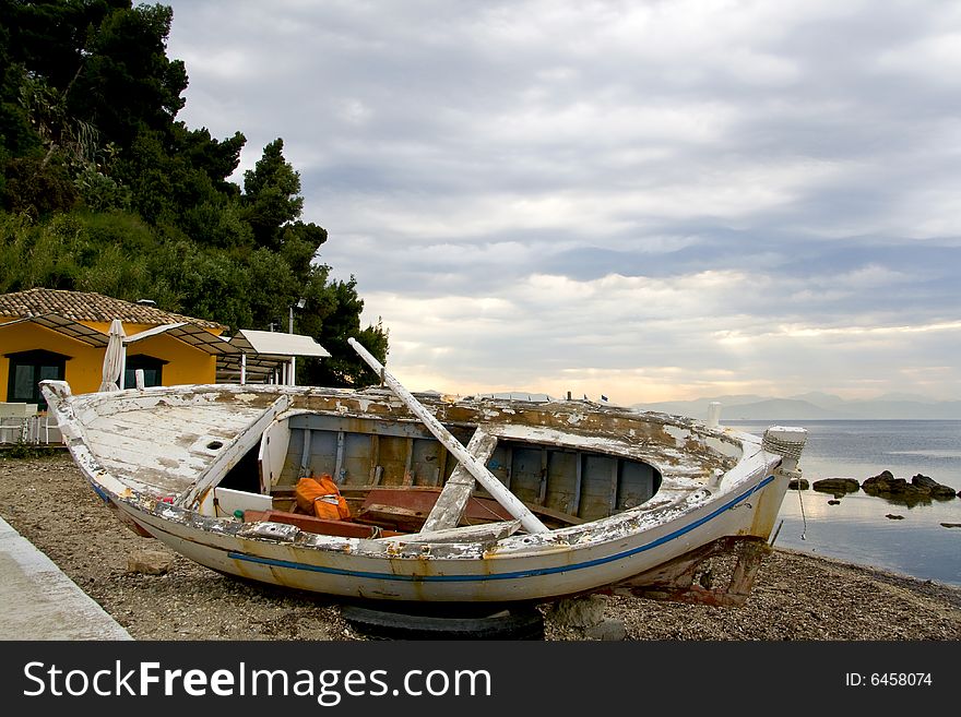 Old wreckage of a traditional greek fishing boat. Old wreckage of a traditional greek fishing boat