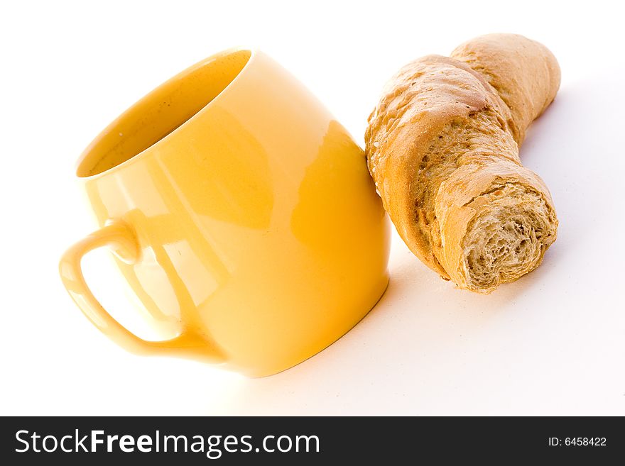 The cup coffee and croissant on white background