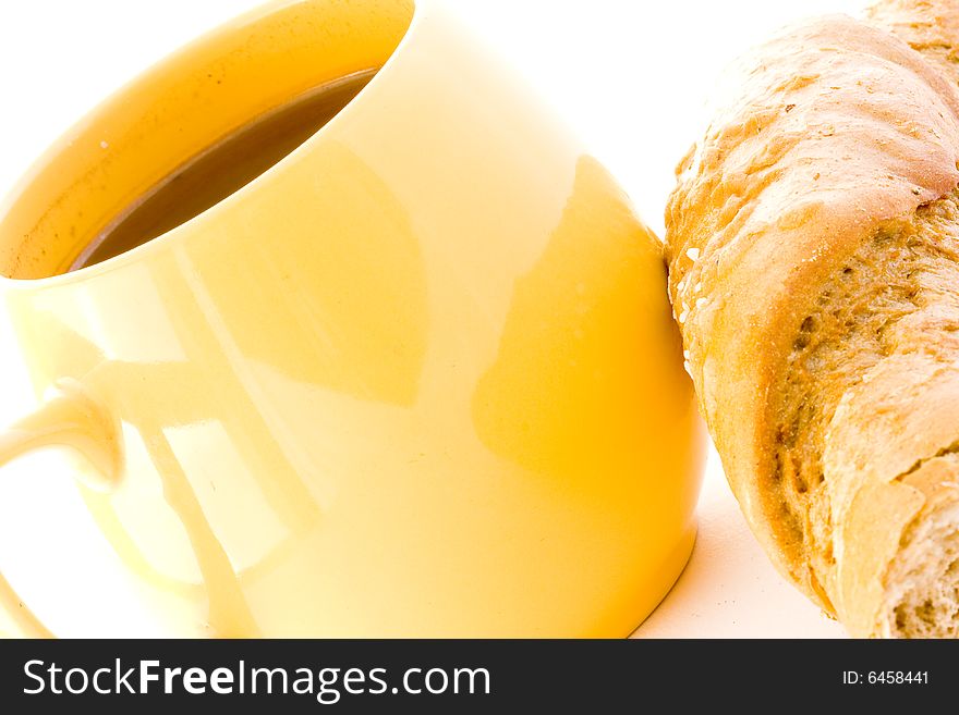 The cup coffee and croissant on white background