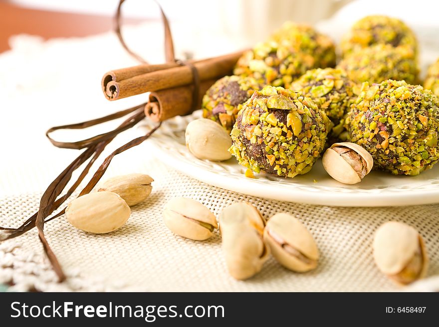 Handmade chocolates coated with pistachio