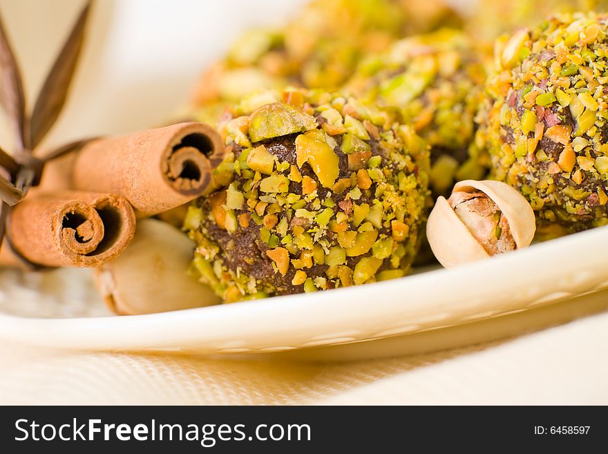 Handmade chocolates coated with pistachio