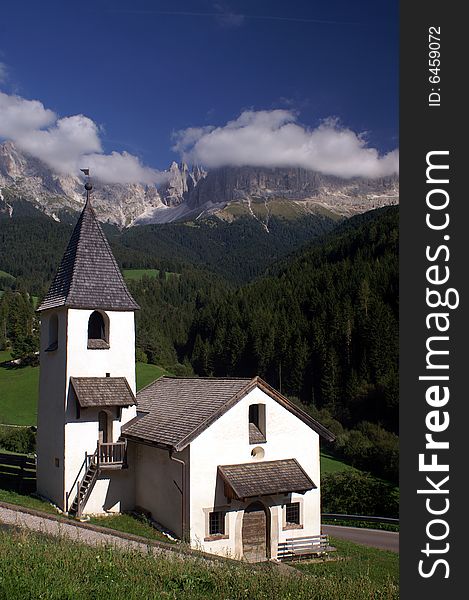 White church in a valley in the Dolomites, Italy. White church in a valley in the Dolomites, Italy