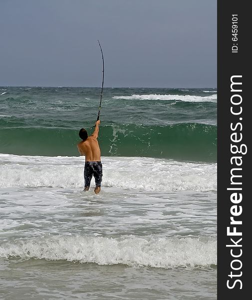 Man Surf Fishing
