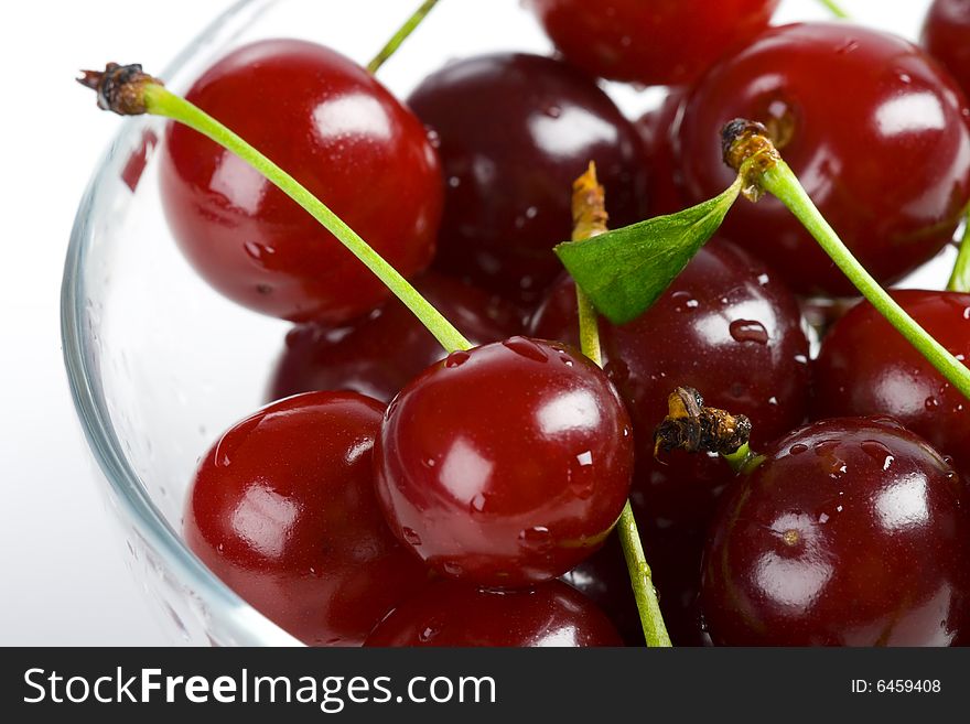 Heap sweet cherry in a transparent bowl