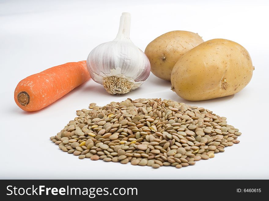 Handful of uncooked lentils isolated on white