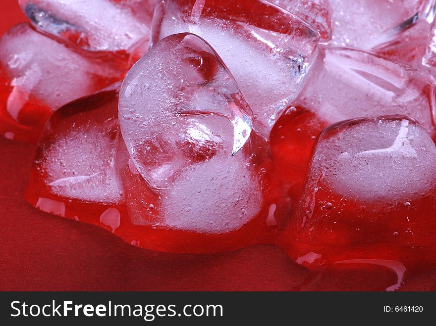 Ice cubes in red background. Ice cubes in red background