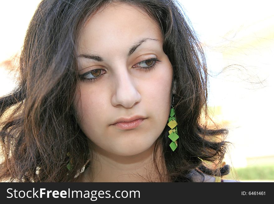 Pretty brunette girl looking to the side. Pretty brunette girl looking to the side.