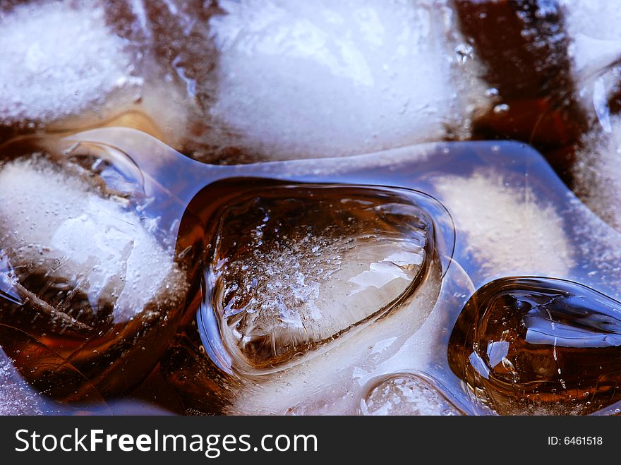 Alcohol drink with ice cube in  cristal glass