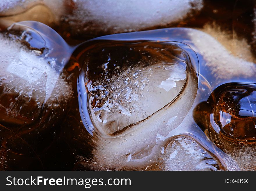 Alcohol drink with ice cube in cristal glass