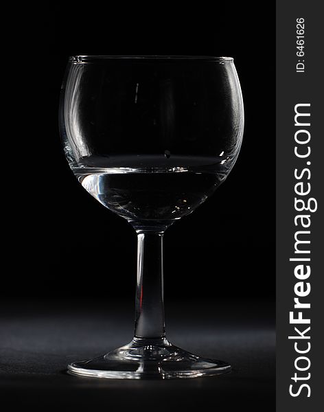 Drinking glass in black background