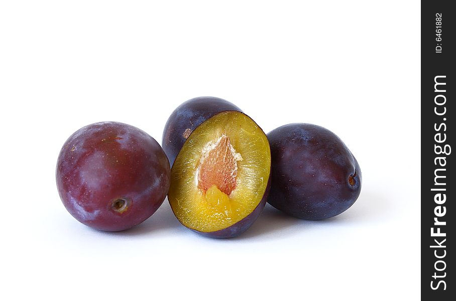 Ripe plums isolated on a white background