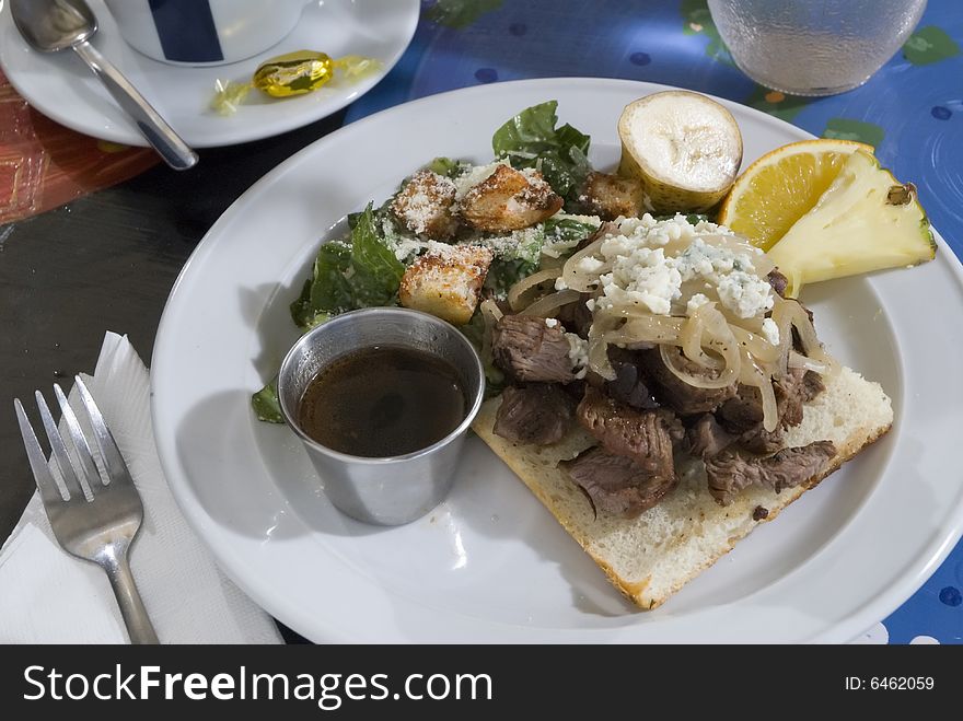 Chopped steak with onions and caesar salad