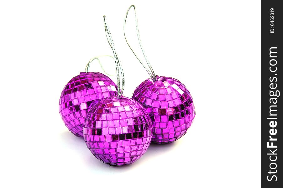Shot of three pink christmas baubles on white