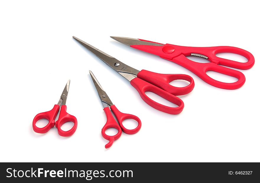 Four pairs of scissors on a white background