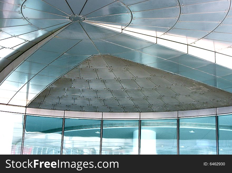 This is the ceiling of a modern building's entrance. This is the ceiling of a modern building's entrance