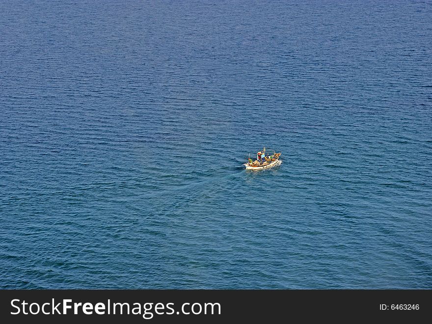Aerial view of fishing boat in Paralia Pieria, Greece.
