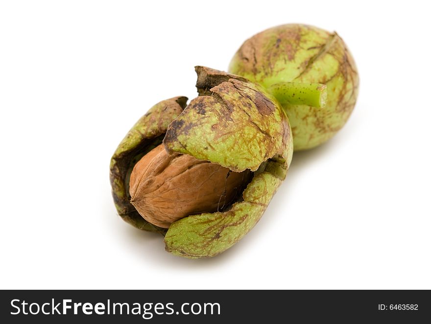 Fresh ripe walnuts on white background