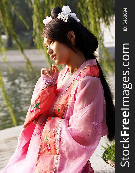 A girl in Chinese ancient dress.She is in pondering . A girl in Chinese ancient dress.She is in pondering ....
