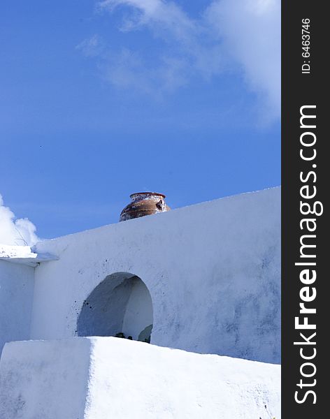 Vase set in whitewashed wall, Folegandros, Greece