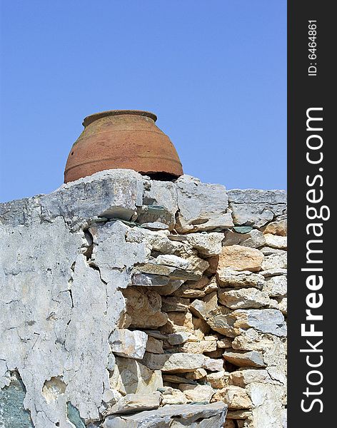 Vase set in old wall, Folegandros, Greece