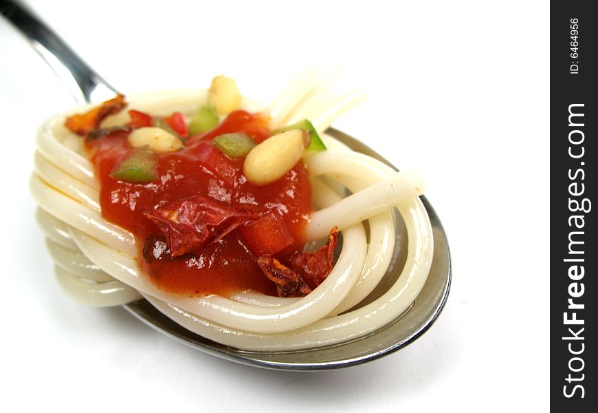 A spoon of spaghetti with sauce