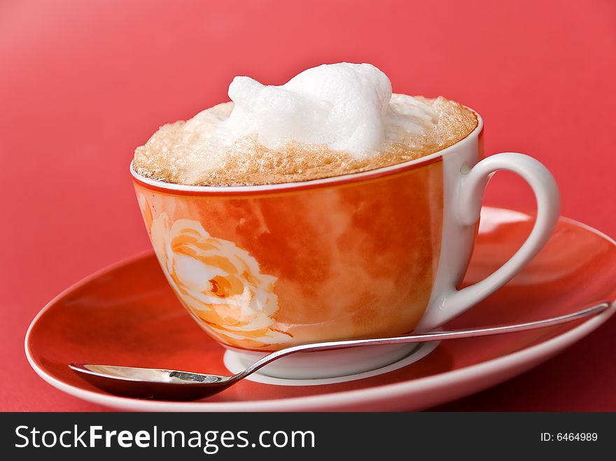 A cup of cappuccino with milk foam