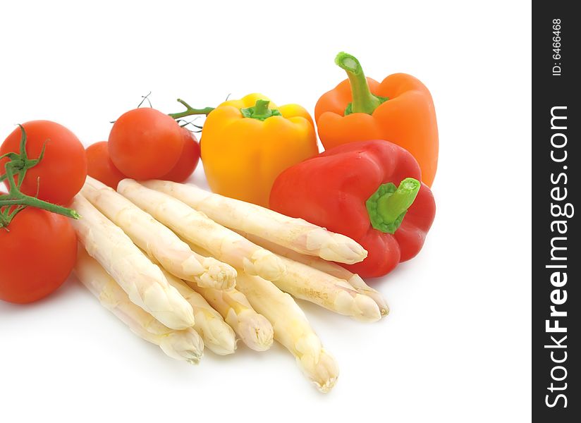 Fresh asparagus, tomato  and paprika on white background.