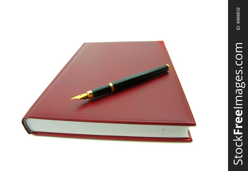 Notebook and pen isolated on a white background.