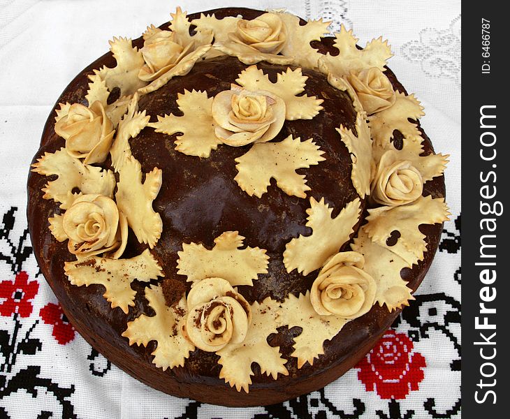 Traditional celebratory Ukrainian loaf decorated with roses from the dough