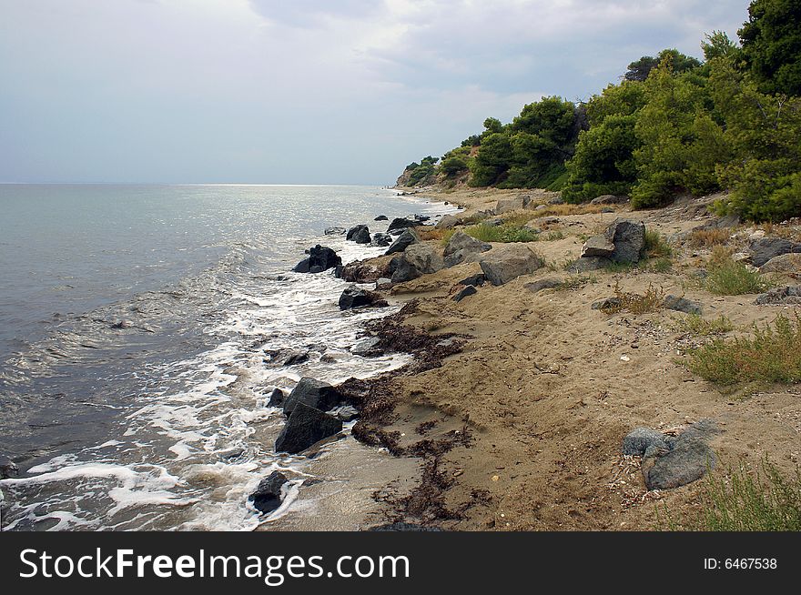 The quiet beach of Psakoudia (Halkidiki) on a rainy day in September. The quiet beach of Psakoudia (Halkidiki) on a rainy day in September.