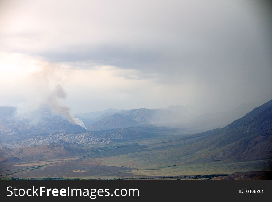 Thunderstorm in the mountains and a wildfire started by a lightning strike