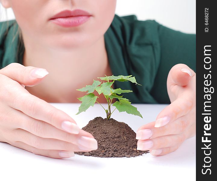 Young Woman And Green Sprout