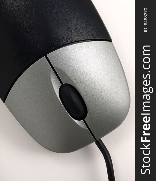 Black Computer Mouse with Silver Buttons top close up view. Black Computer Mouse with Silver Buttons top close up view