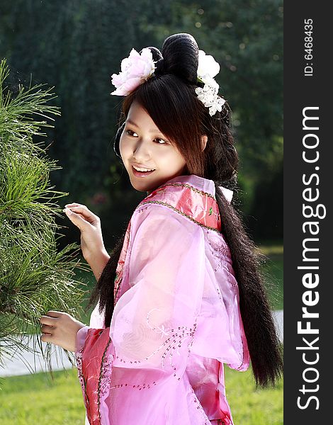 A girl in Chinese ancient dress.She is so beautiful and lovely. A girl in Chinese ancient dress.She is so beautiful and lovely.
