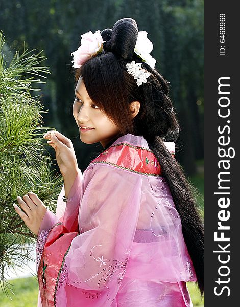 A girl in Chinese ancient dress. She is so beautiful and lovely. A girl in Chinese ancient dress. She is so beautiful and lovely.