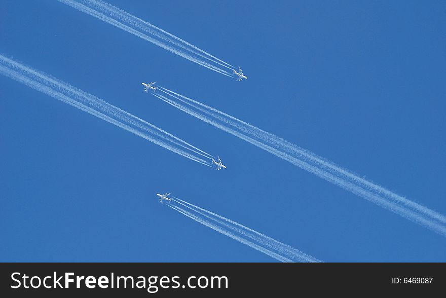 Fast planes on a air show. blue sky background. Fast planes on a air show. blue sky background