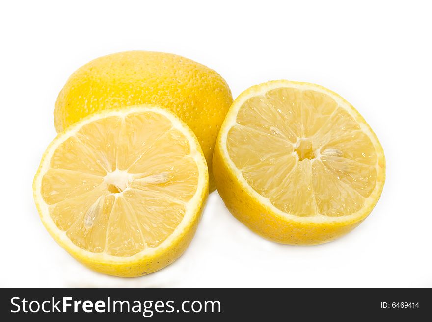 Detail of a sliced lemon on white